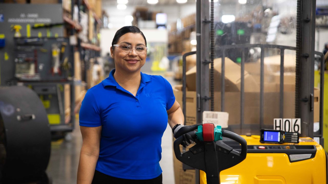Female Manufacturing Employee In Warehouse